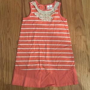 Coral colored with white stripes and beautiful lace decal at the neck